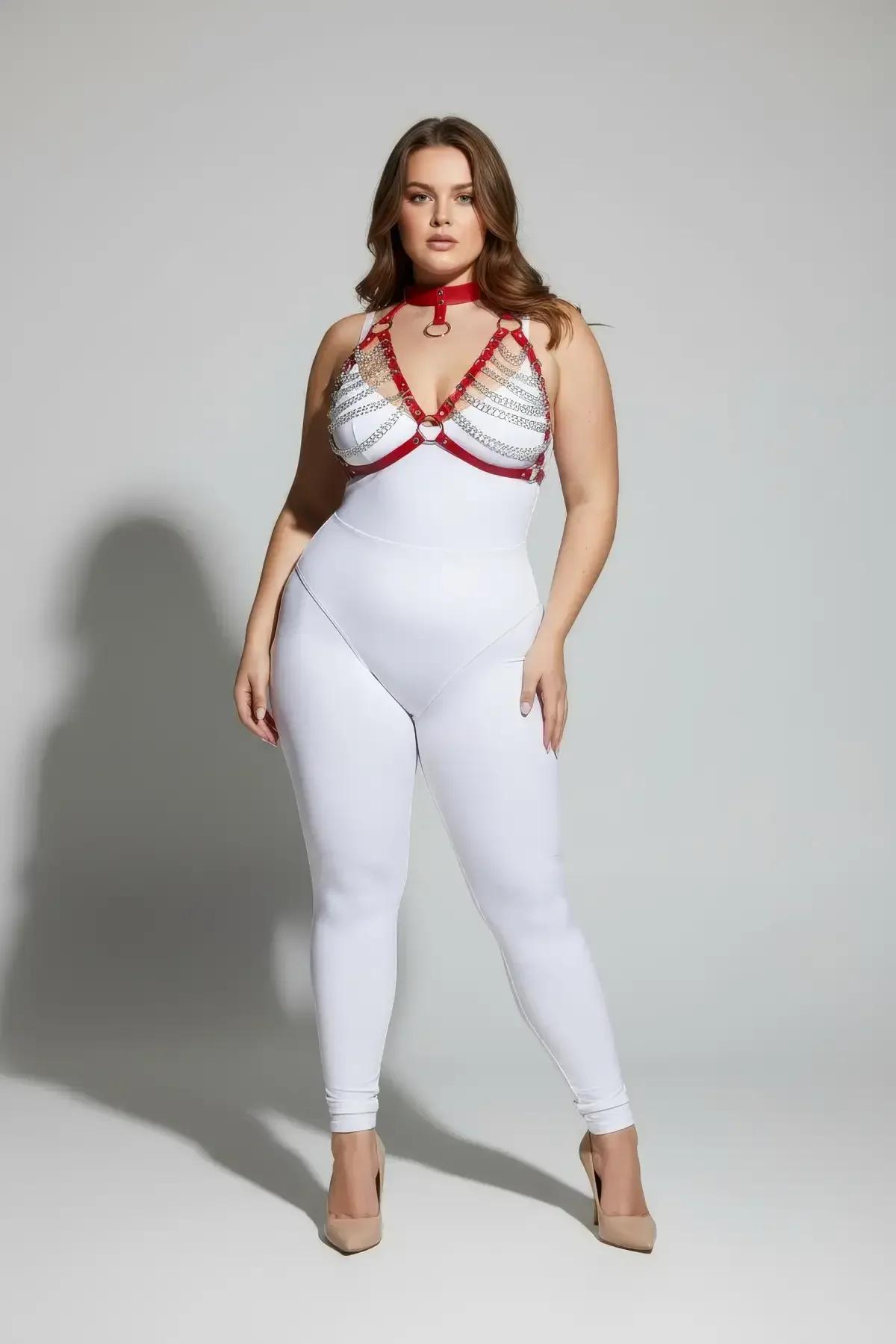 red vegan leather harness bra with choker collar styled over white fitted bodysuit