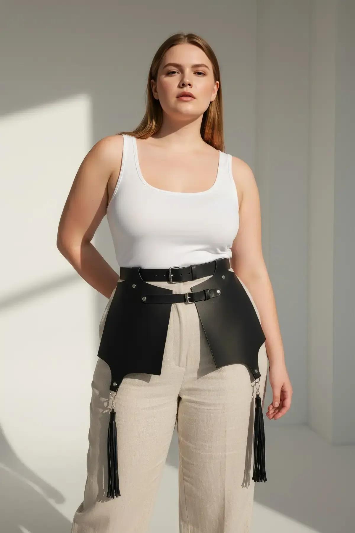 black vegan faux leather skirt panel harness with tassel clusters at panel tips front view