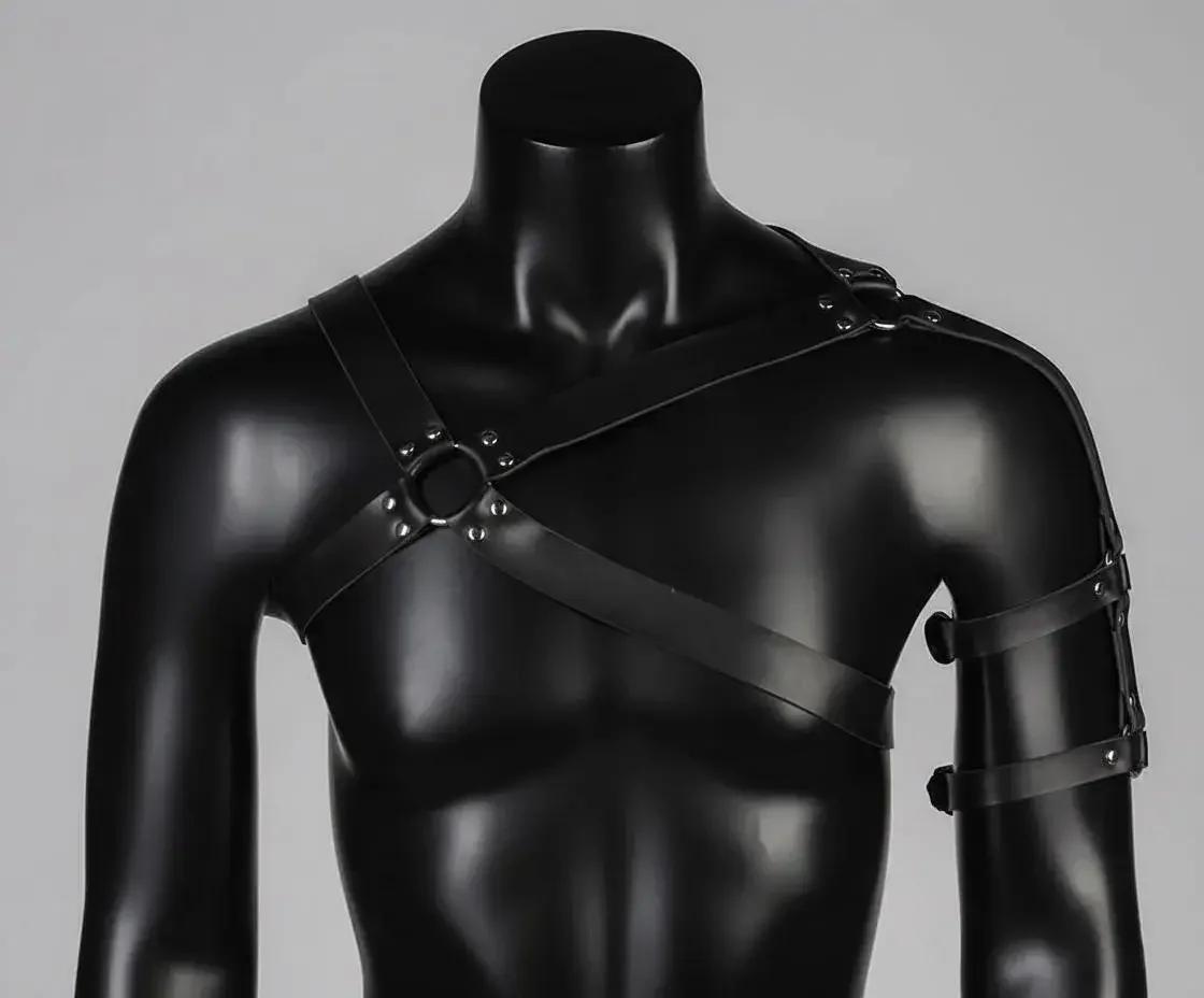 black vegan leather upper arm band from asymmetric chest harness worn on upper arm