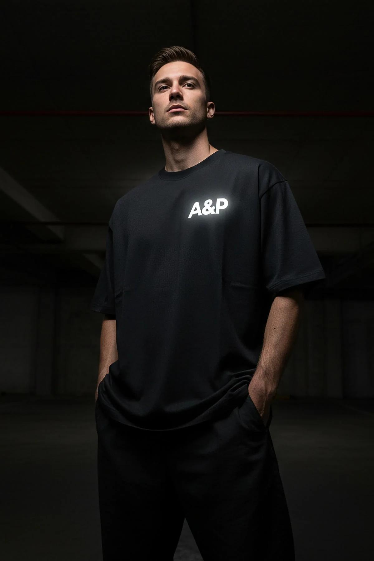 custom printed black oversize cotton tee with large reflective A&P back logo drop-shoulder streetwear silhouette