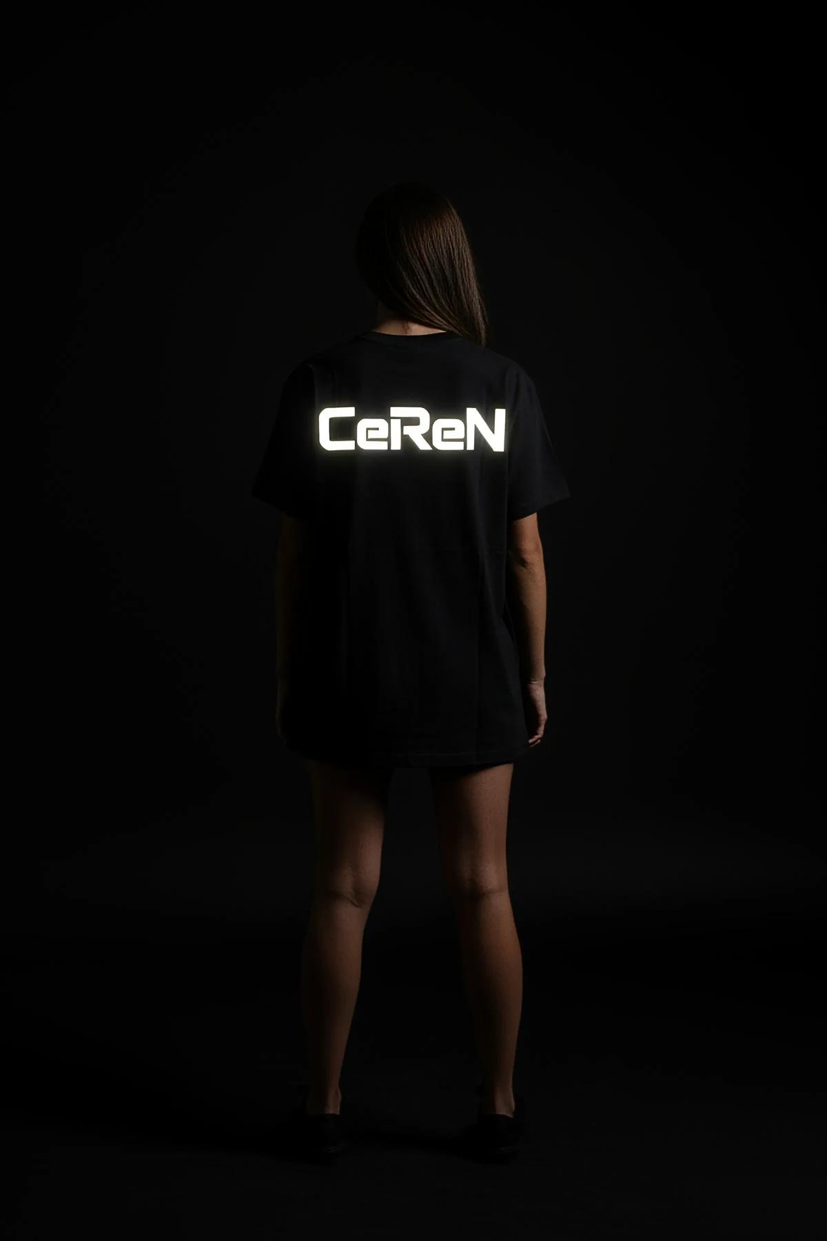 reflective oversized tee grey with bold white glowing custom text print worn at night