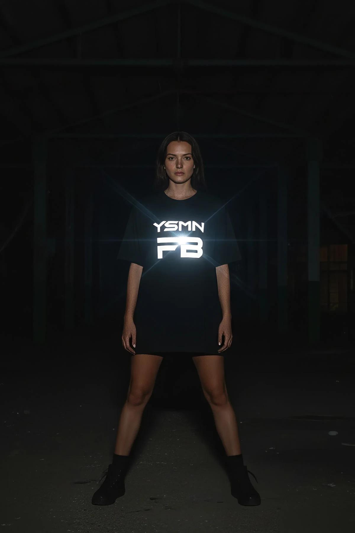 black reflective graphic t-shirt bold white YSMN logo glowing on chest in low light