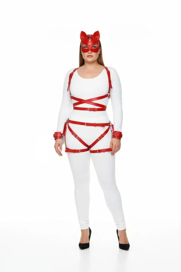 red faux leather full body strap harness set with thigh garter wrist cuffs and cat-ear mask worn over white outfit silver buc