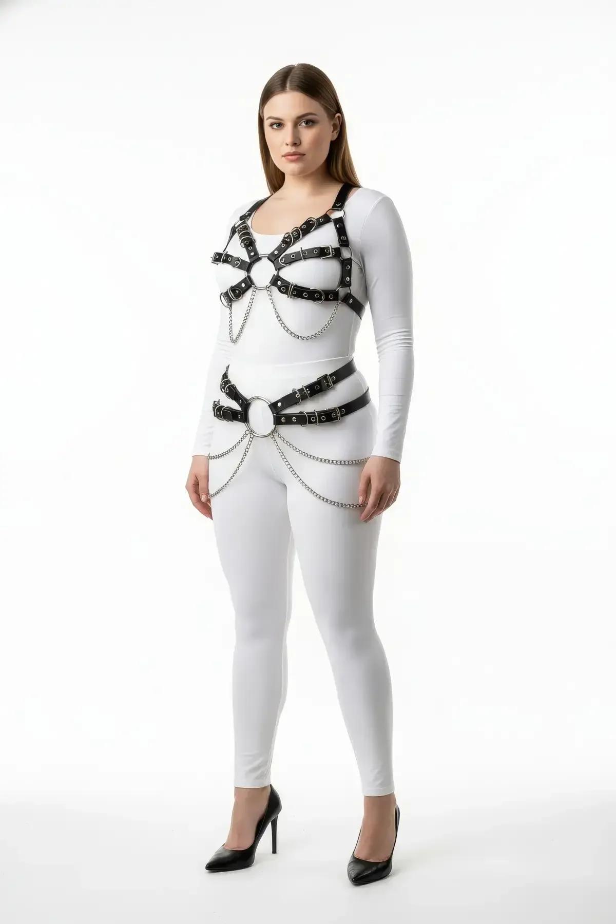 black faux leather full body harness with dual O-rings and silver draping chains worn over white top