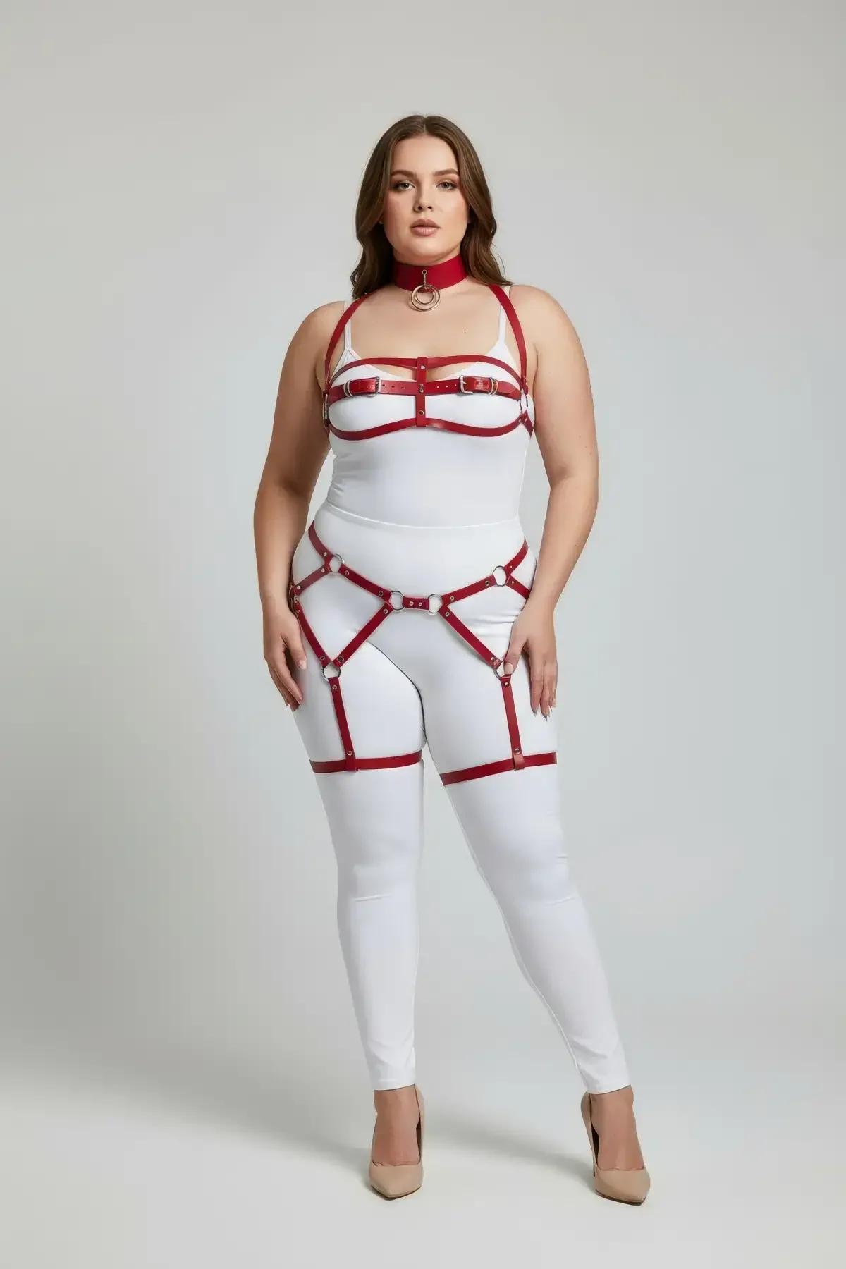 Red faux leather full body harness set with O-ring choker, structured chest frame, and dual thigh garter straps on plus-size