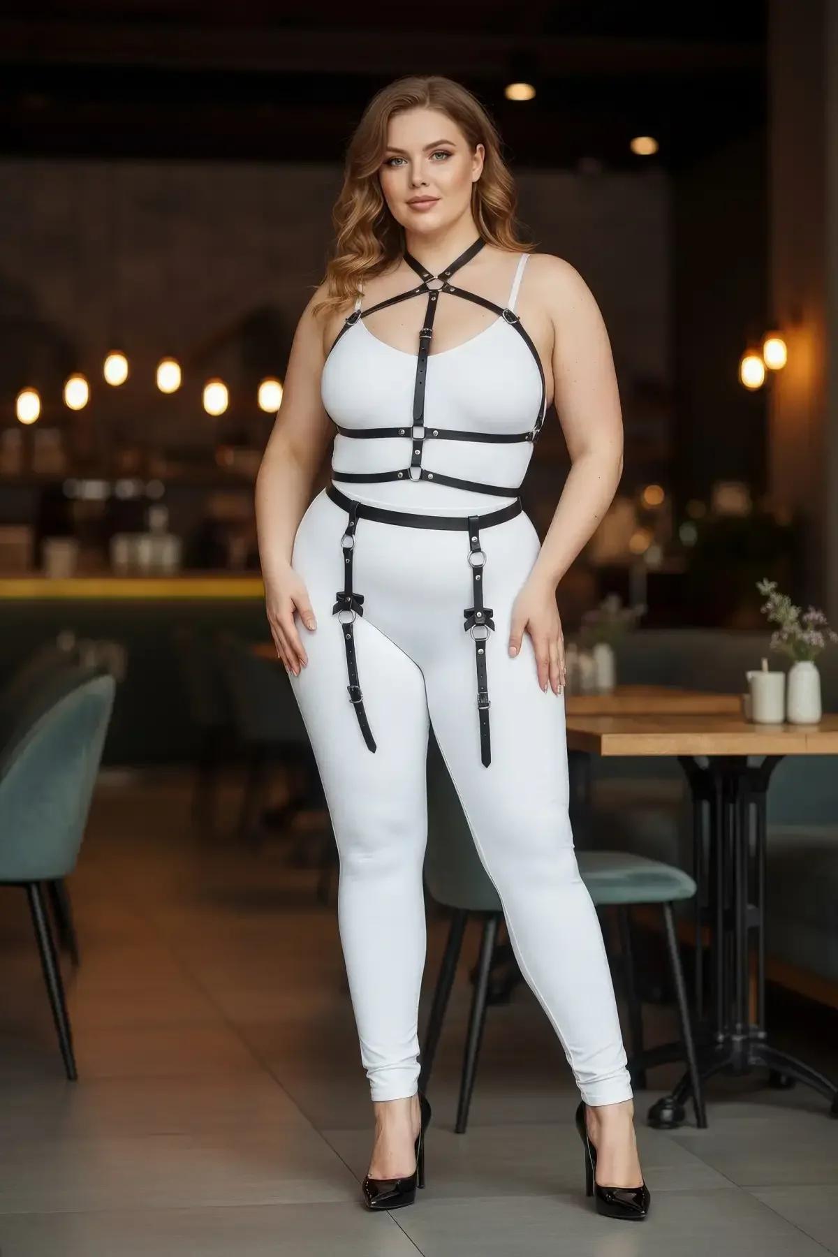 plus size black faux leather full body harness with chest cage O-rings and garter straps worn over white outfit