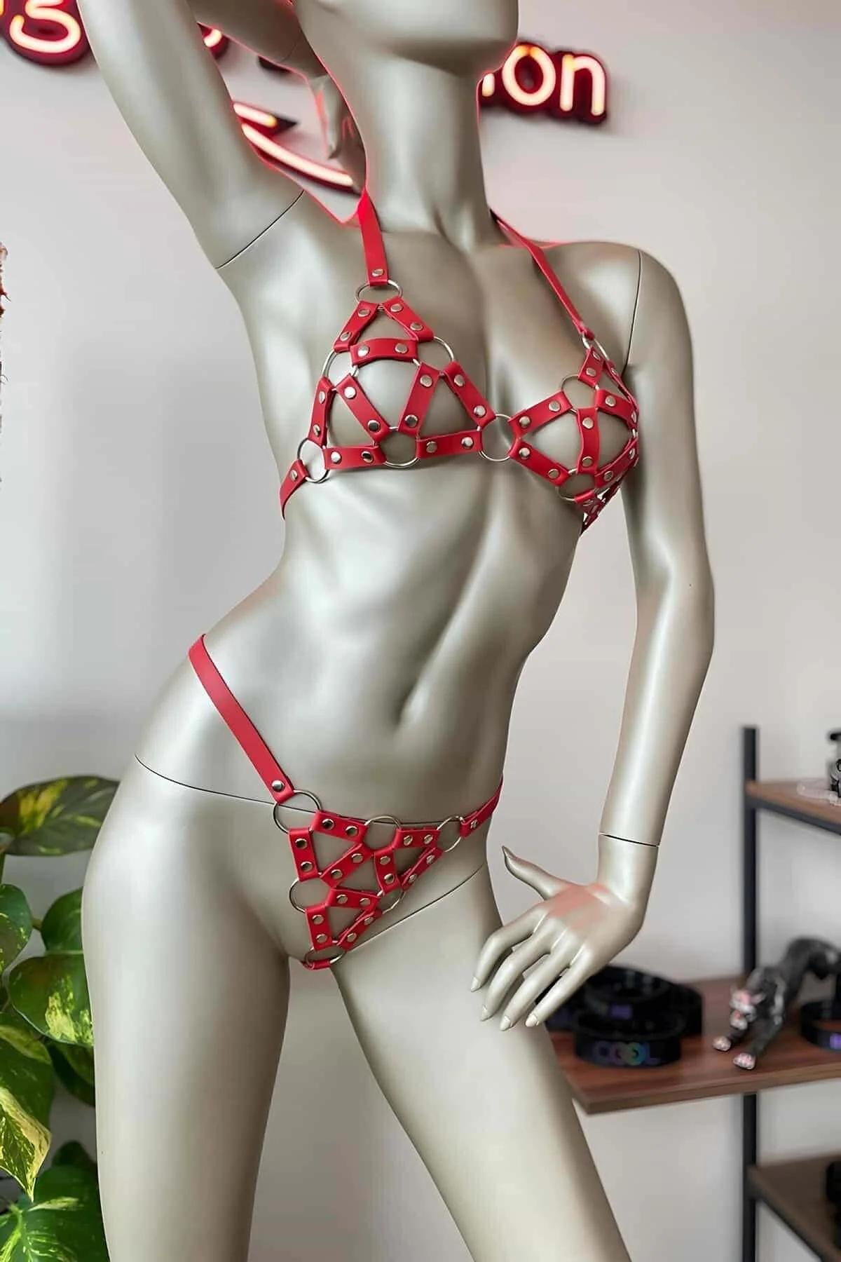 red faux leather cage harness bra and panty set with silver O-rings and studs on mannequin