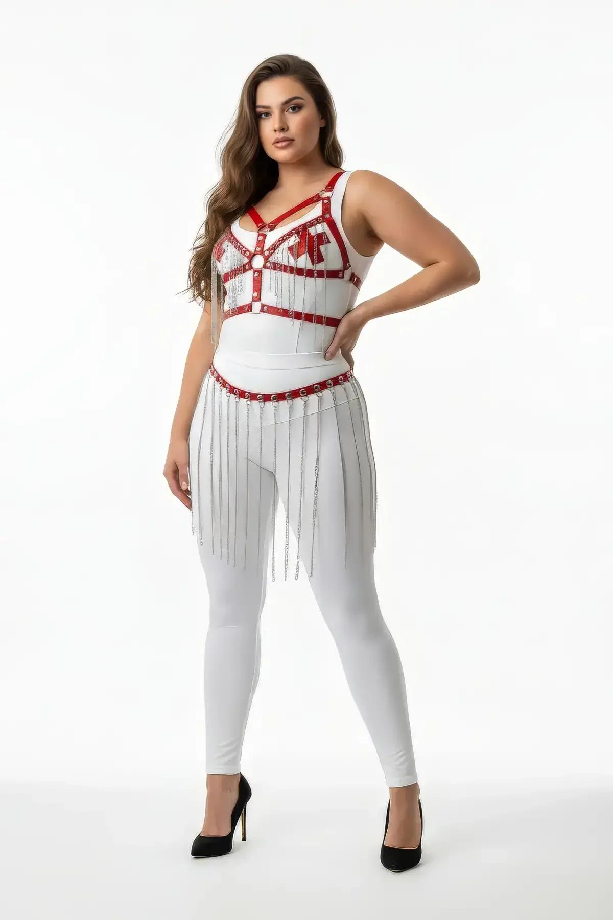 White faux leather body harness set with red bust accent straps and silver chain fringe skirt belt worn over white leggings