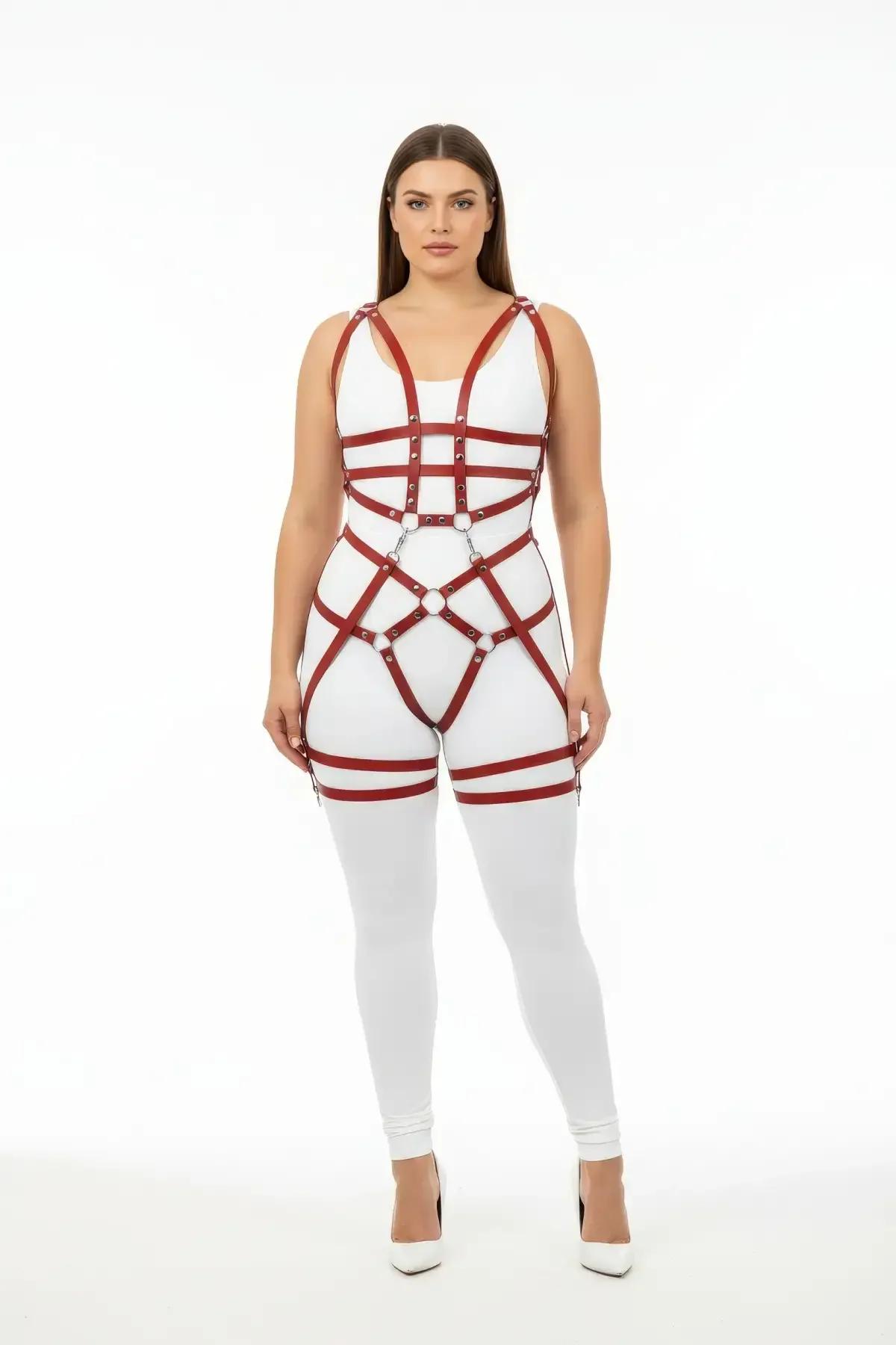 Claret red full body harness with silver O-rings and double thigh straps worn over white bodysuit, front view