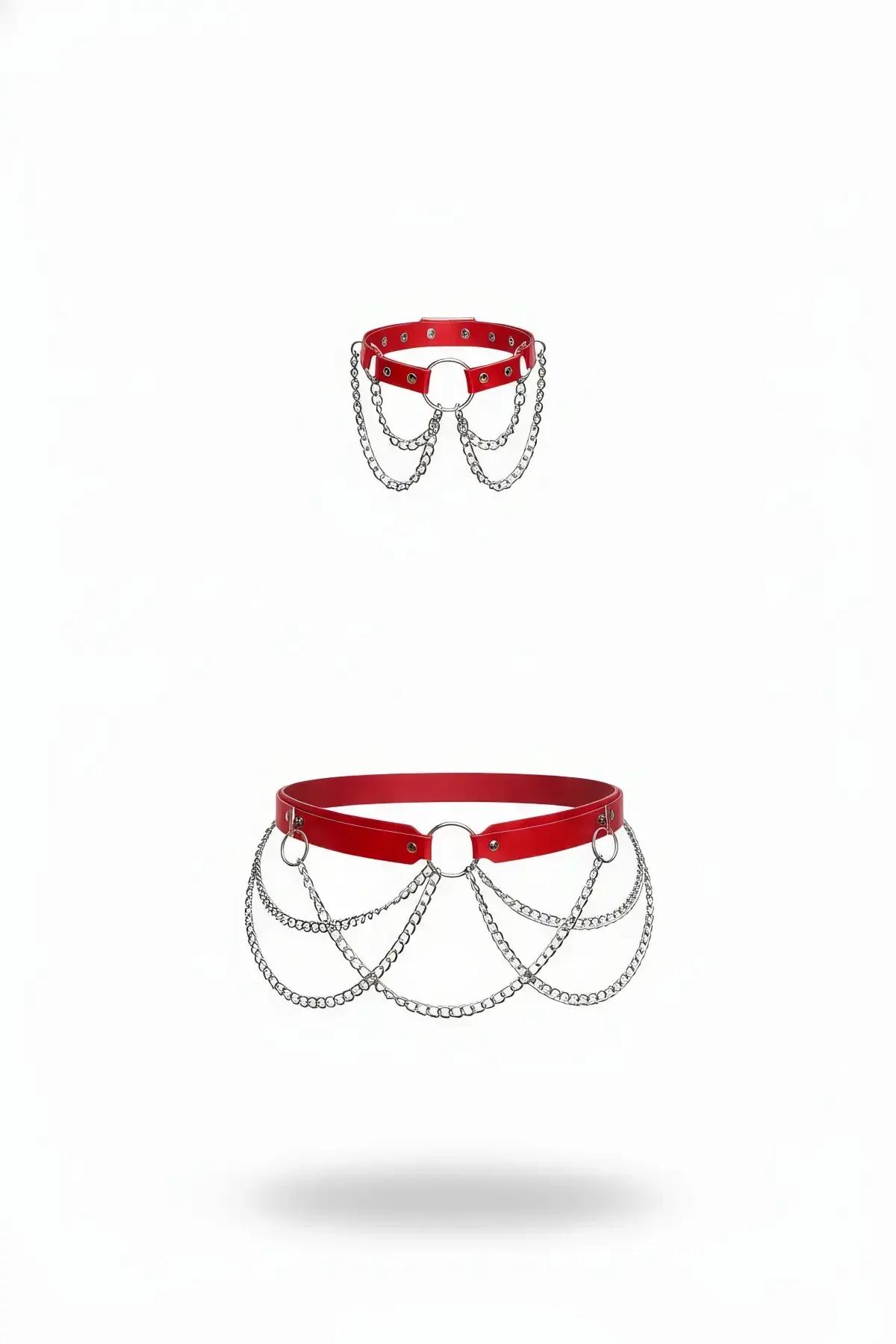 red faux leather waist harness with central O-ring and five cascading silver chain drapes on white background