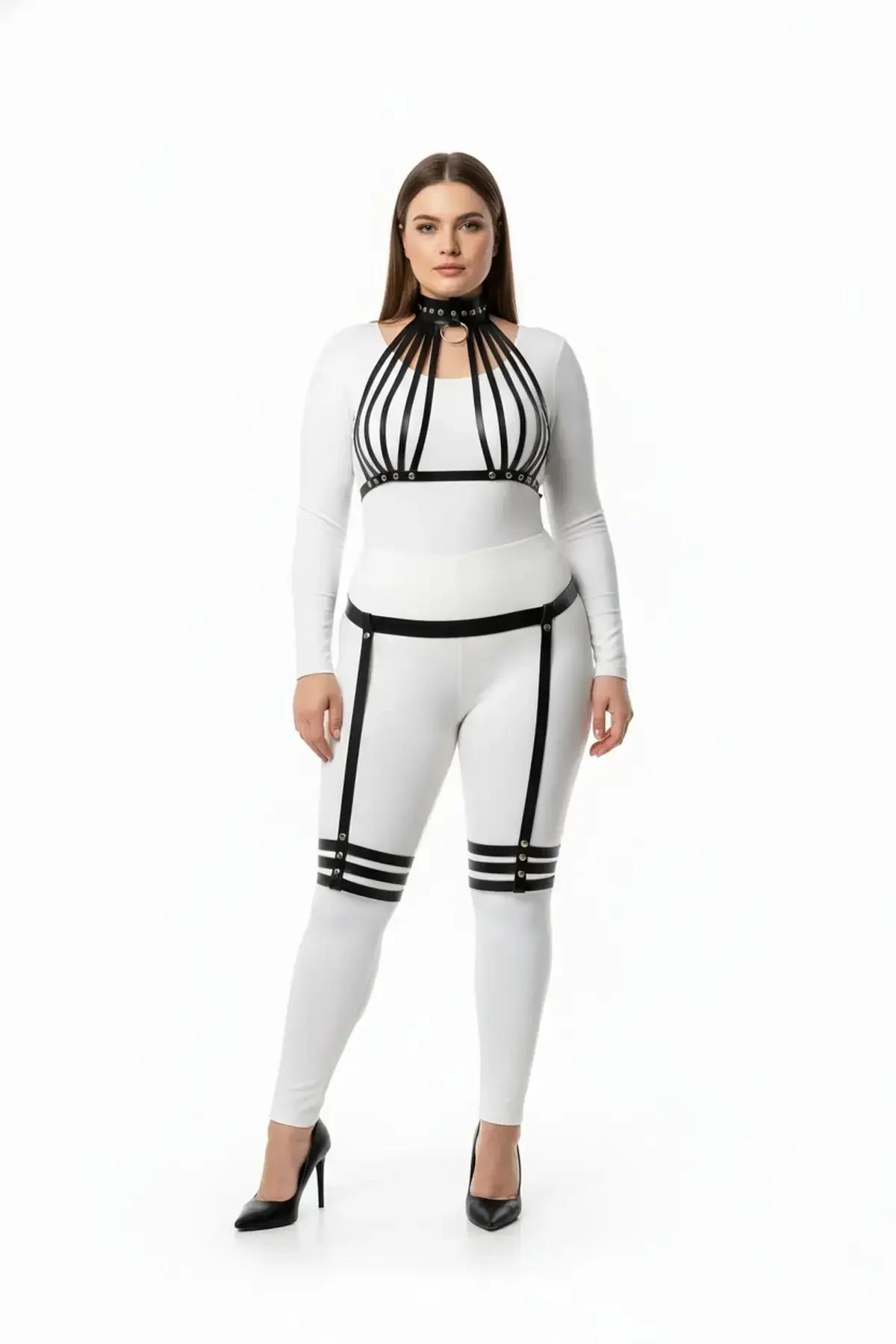 black faux leather full body harness with caged chest, choker collar, waist belt and double-band thigh garters, worn over whi
