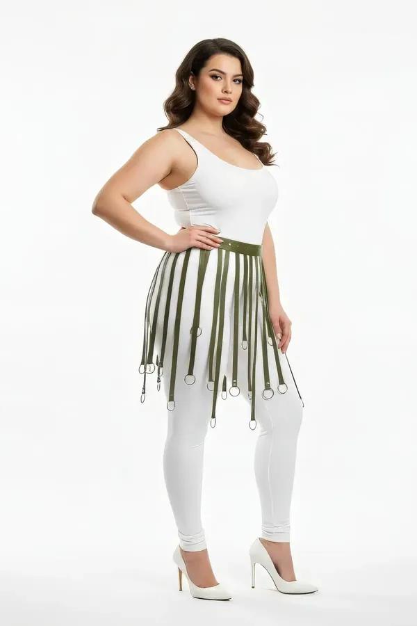 Olive green faux leather fringe waist harness with silver O-rings worn over white leggings, mid-thigh strap drop