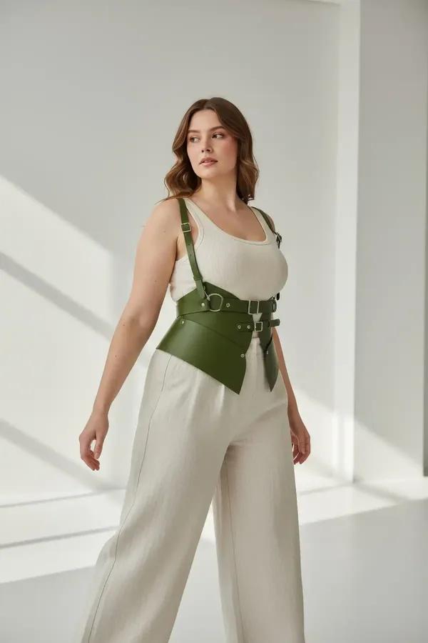 olive green faux leather corset belt with adjustable shoulder harness straps and silver O-ring buckle hardware