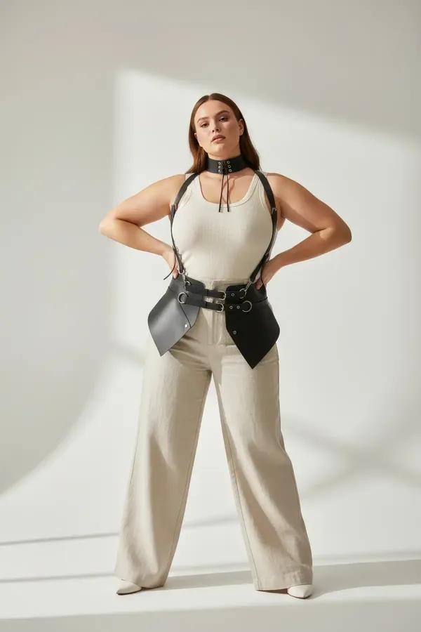 black faux leather body harness with integrated wide choker eyelet tie front angular waist panels silver O-ring hardware worn