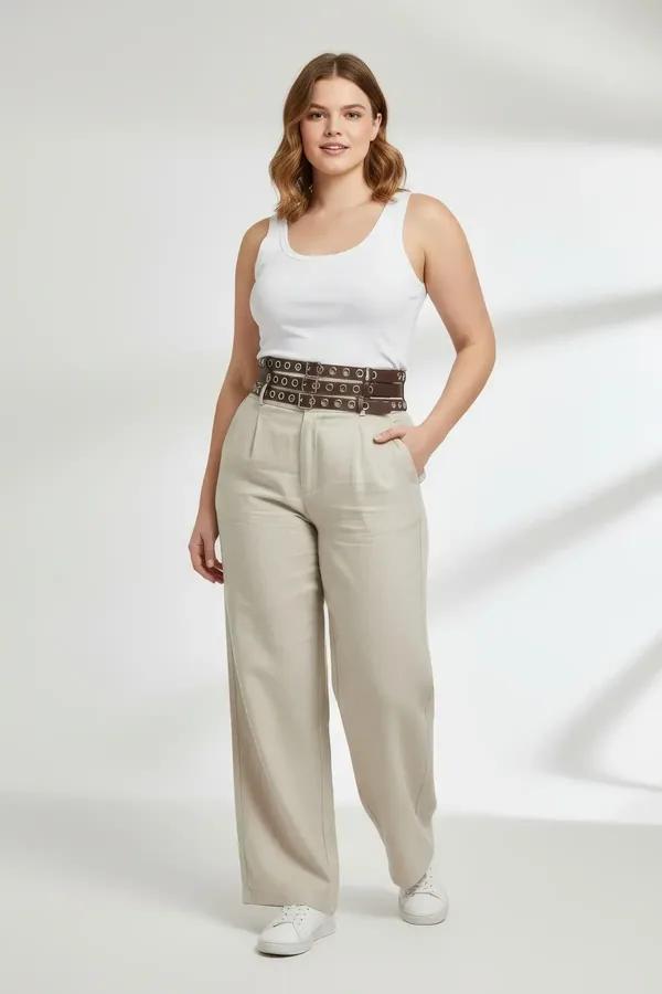 dark brown faux leather three-strap waist harness belt with polished silver metal eyelets worn at the waist