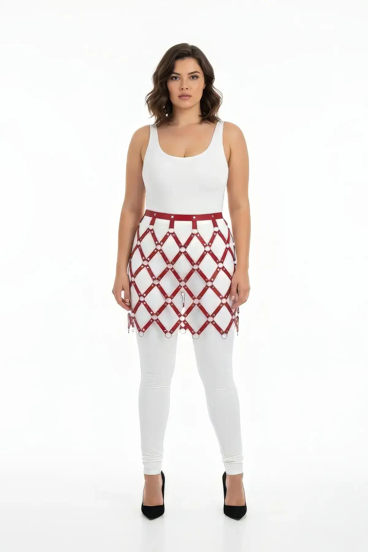burgundy faux leather harness skirt with silver O-ring diamond grid overlay worn over white leggings