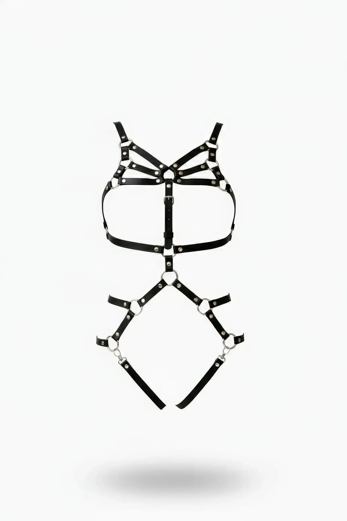 Black faux leather full body harness with multi-strap chest cage, silver O-ring accents, and leg garters on white background