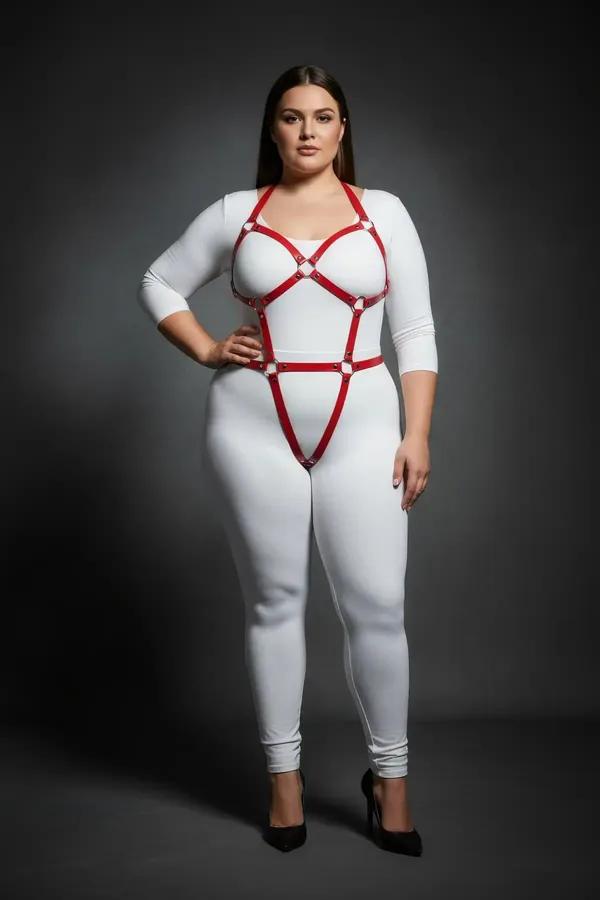 red vegan leather full body harness with gold O-ring detail and X-cross chest cage on plus-size model