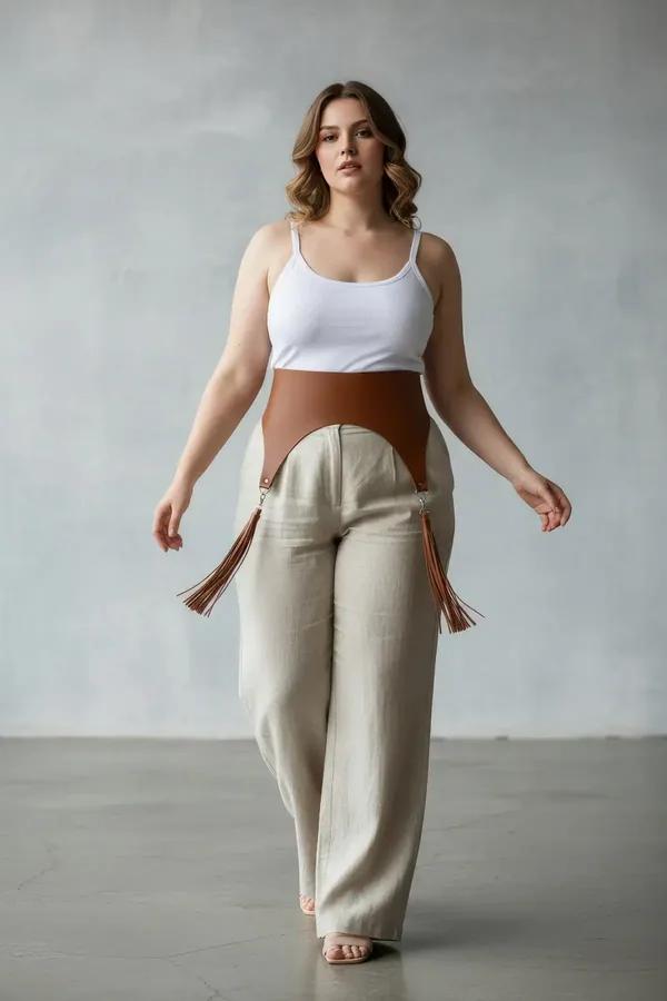 tan faux leather wide waist harness with fringe tassel garter details and silver clip hardware