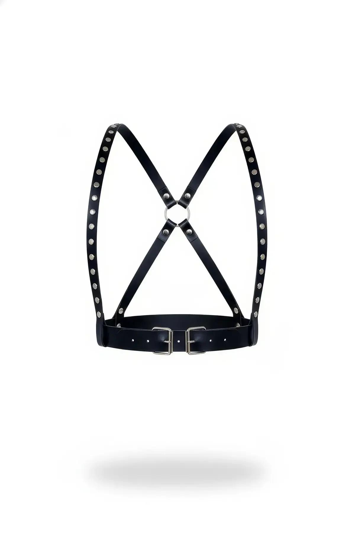 black faux leather chest harness with silver dome studs and X-back crossing straps, dual waist buckles and front O-ring, whit