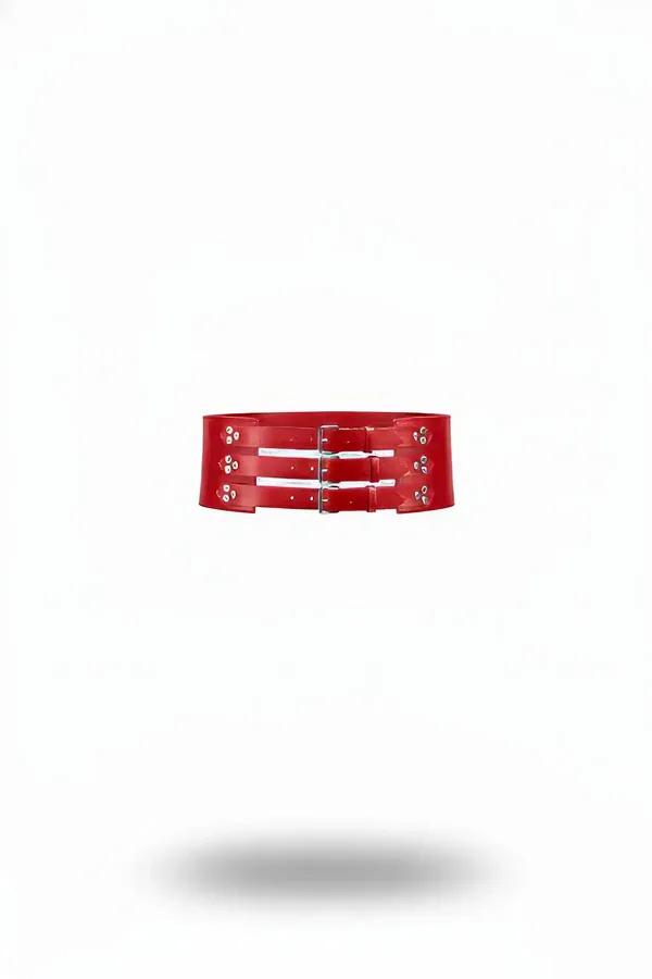 wide red faux leather waist belt with three stacked silver pin buckles front view