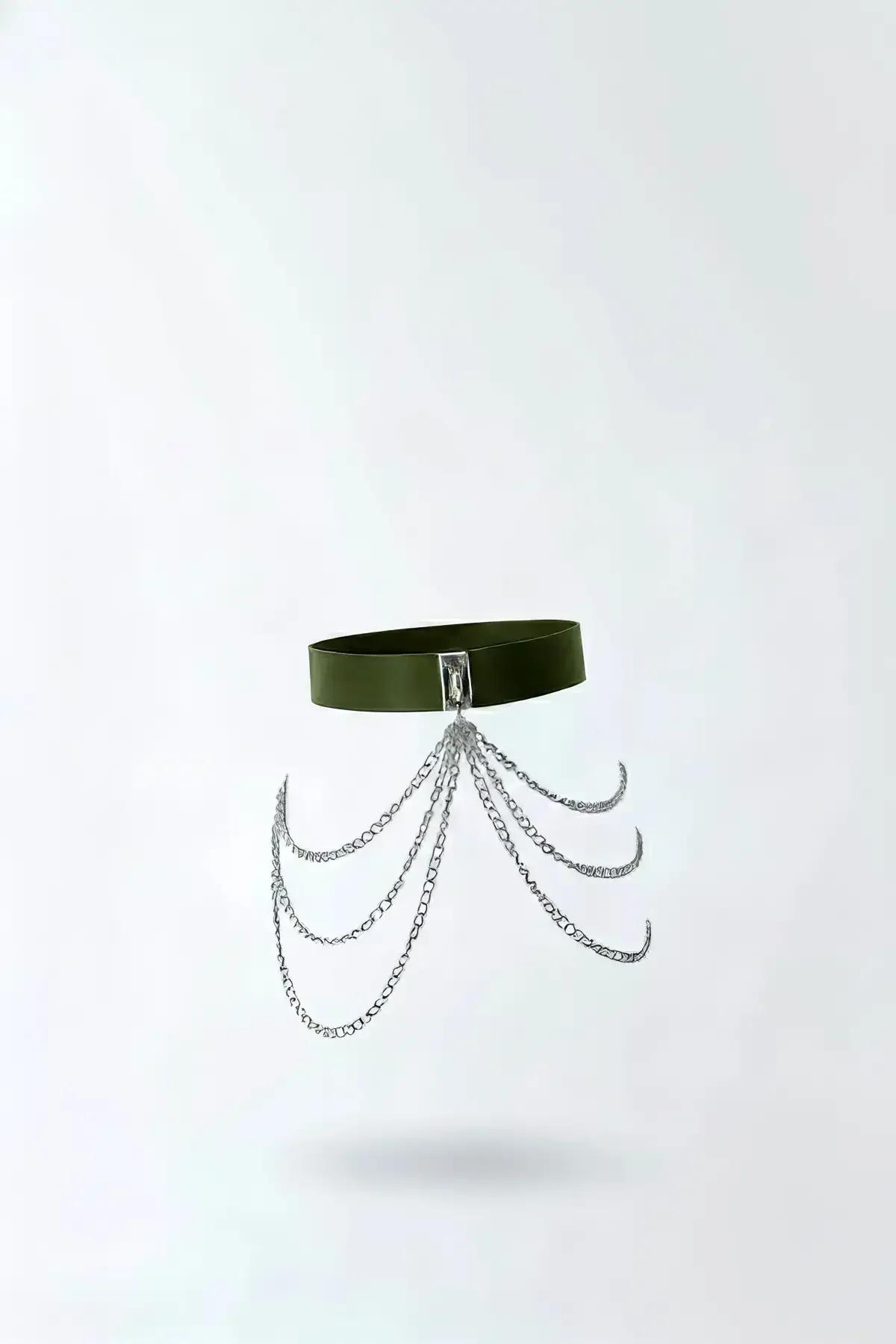 olive green faux leather waist harness with five cascading silver link chains and rectangular silver buckle