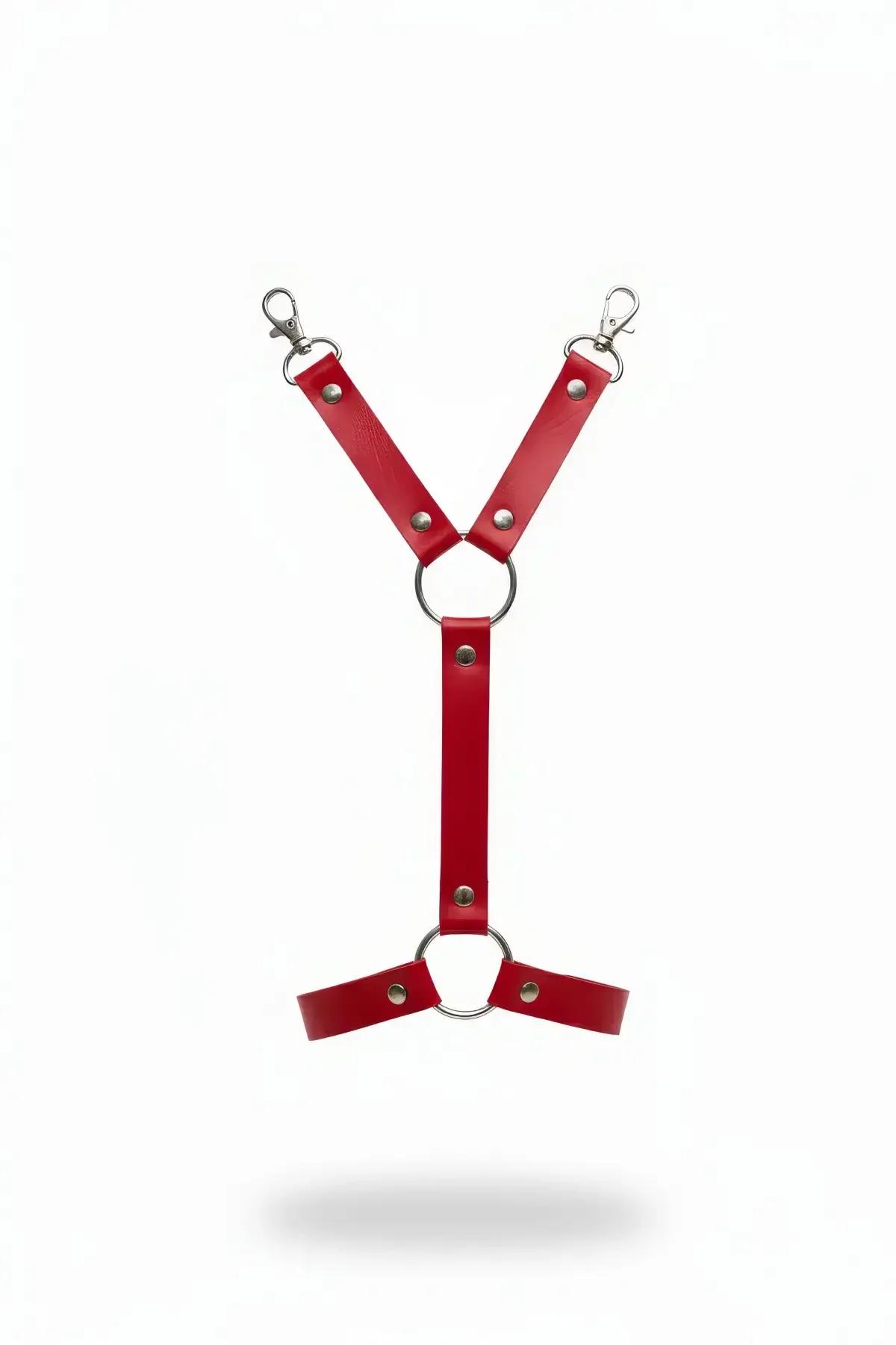 Red faux leather strappy body harness with dual silver O-rings and swivel snap clips on white background