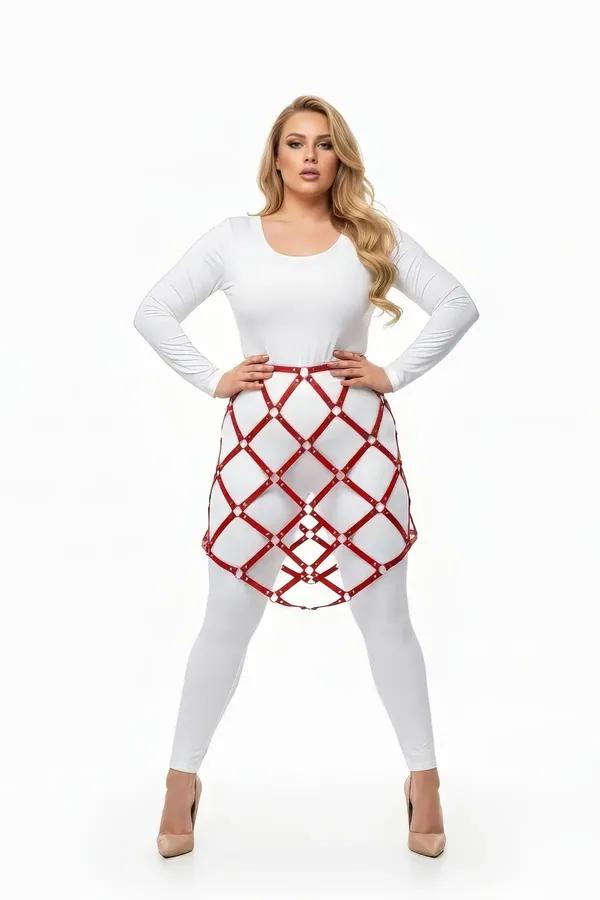 red faux leather lattice cage skirt harness with silver O-ring connectors worn over white leggings, A-line diamond grid silho