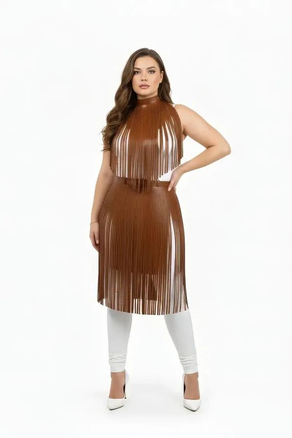 tan faux leather fringed two-piece body harness set with layered fringe top and midi skirt panel worn over white outfit