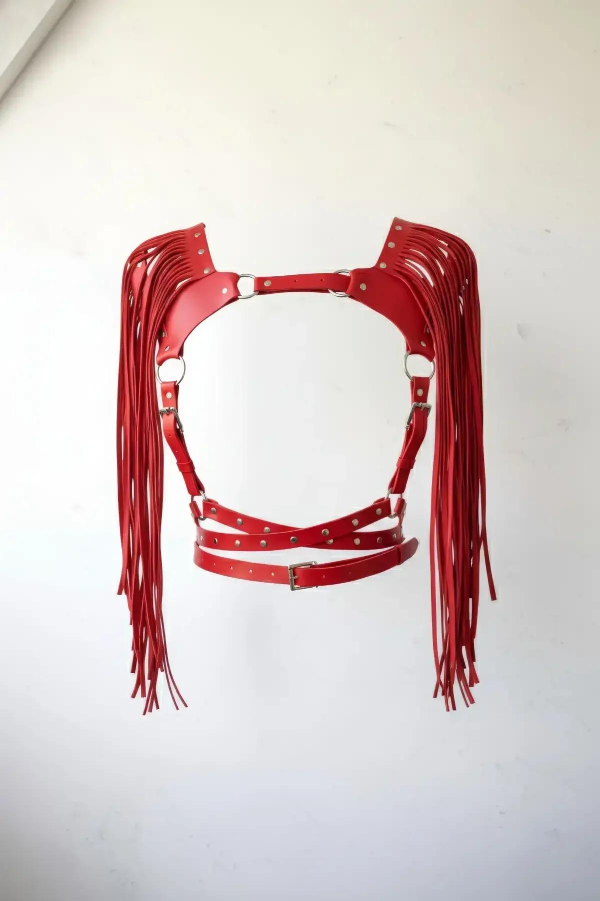Red faux leather chest harness with long shoulder fringe, silver O-rings, and adjustable buckle underbust straps